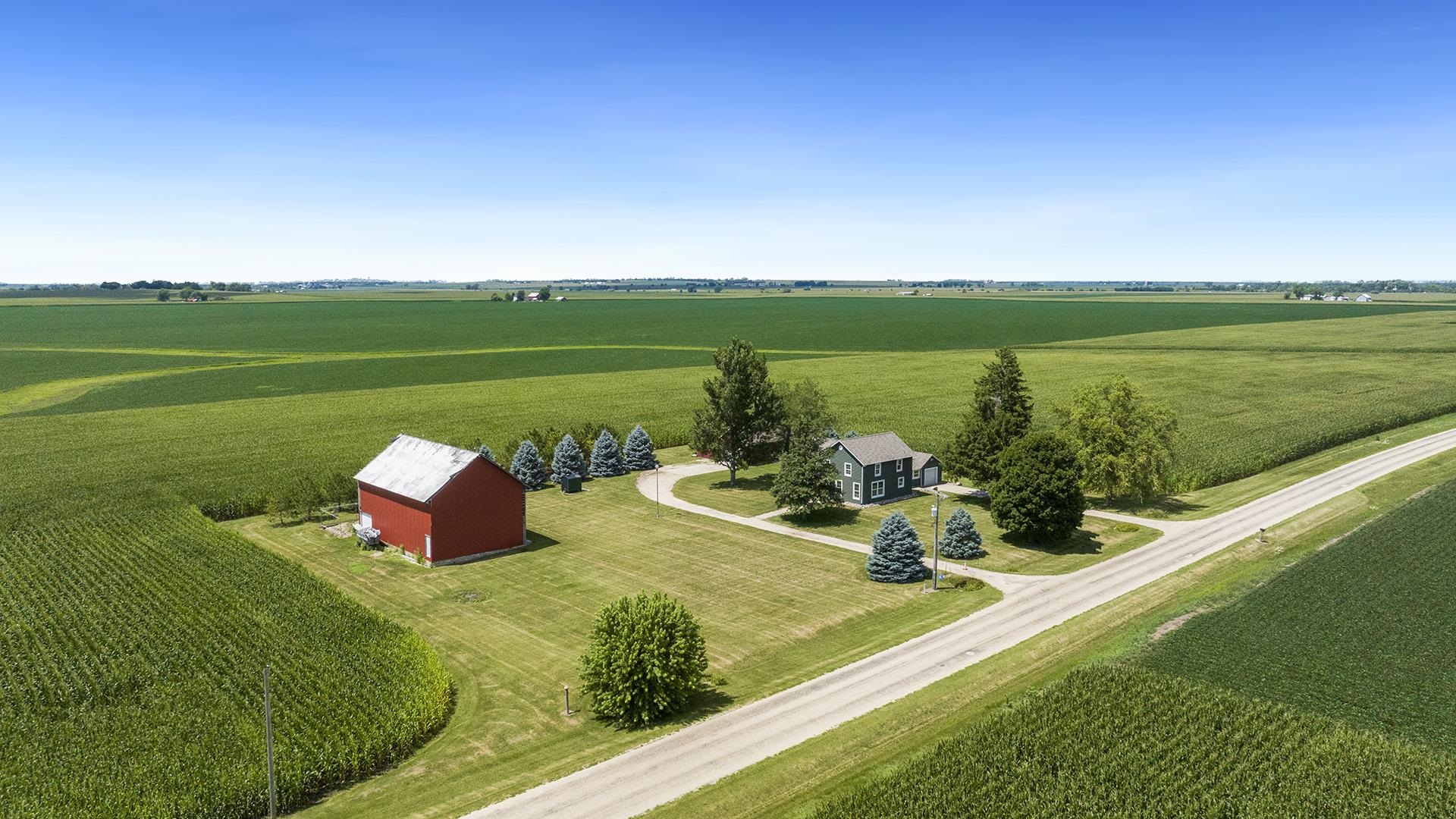 1813 Brooklyn Road Ashton, IL 61006 - Photo 1 of 43 a view of a lake with a yard