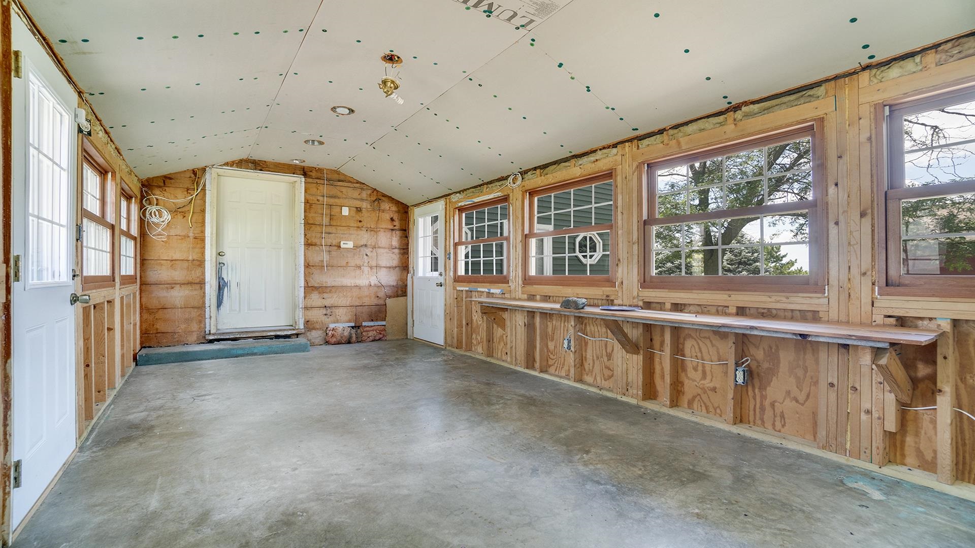 1813 Brooklyn Road Ashton, IL 61006 - Photo 13 of 43 a view of an empty room with a large window