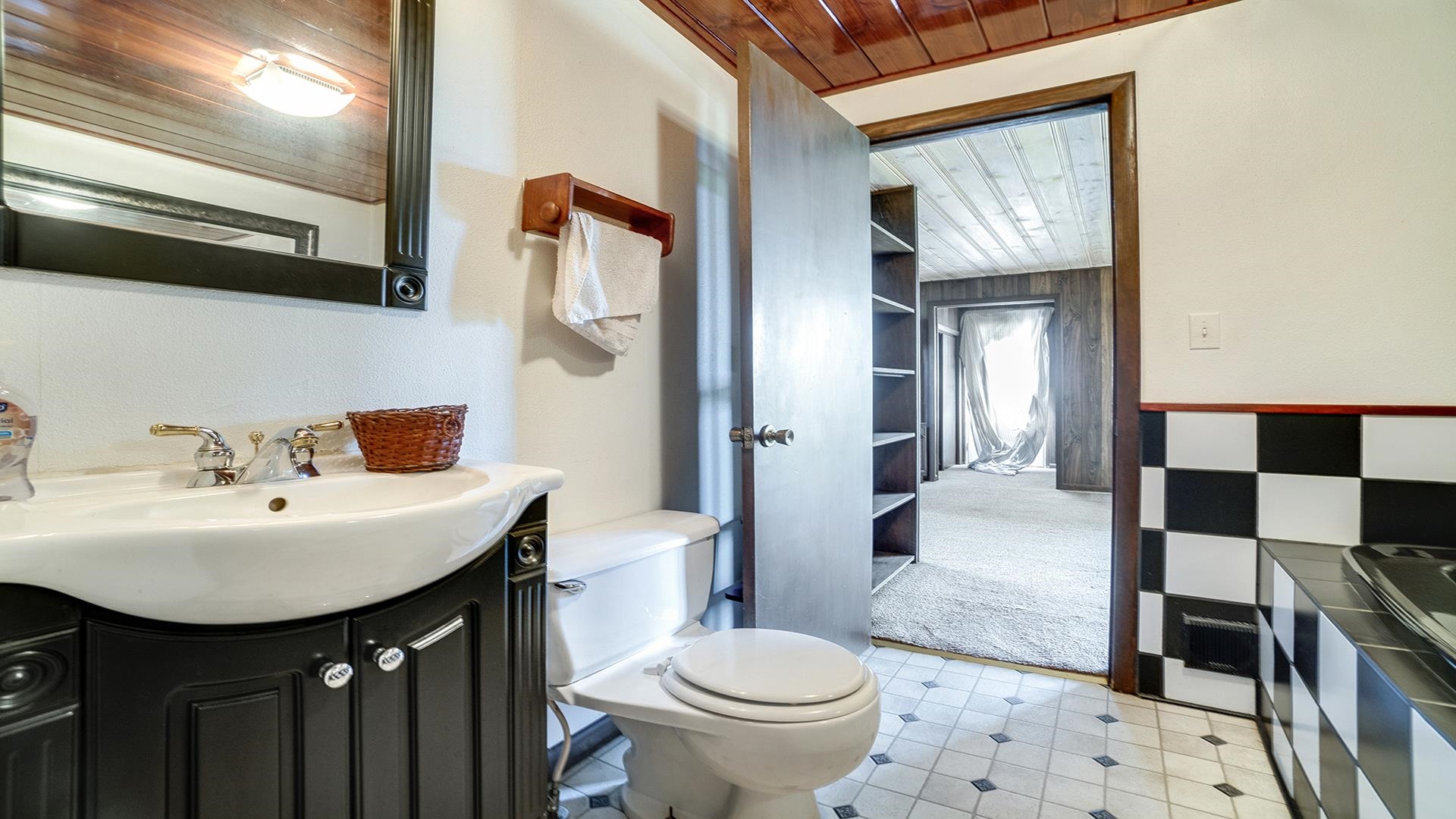 1813 Brooklyn Road Ashton, IL 61006 - Photo 15 of 43 a bathroom with a sink and a mirror
