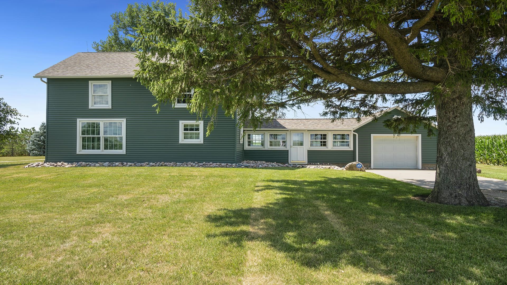 1813 Brooklyn Road Ashton, IL 61006 - Photo 32 of 43 a front view of a house with a garden
