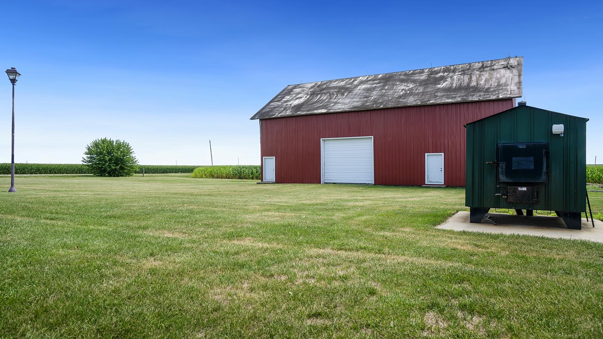 1813 Brooklyn Road Ashton, IL 61006 - Photo 36 of 43 a view of a wooden house with a yard