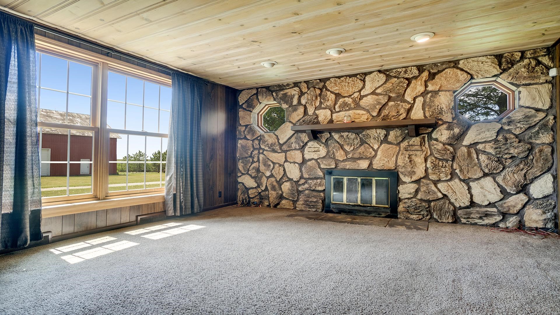 1813 Brooklyn Road Ashton, IL 61006 - Photo 4 of 43 a view of an empty room with a fireplace