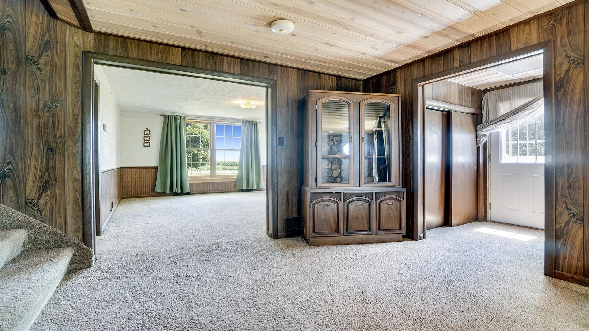 1813 Brooklyn Road Ashton, IL 61006 - Photo 7 of 43 a view of a hallway with furniture and windows