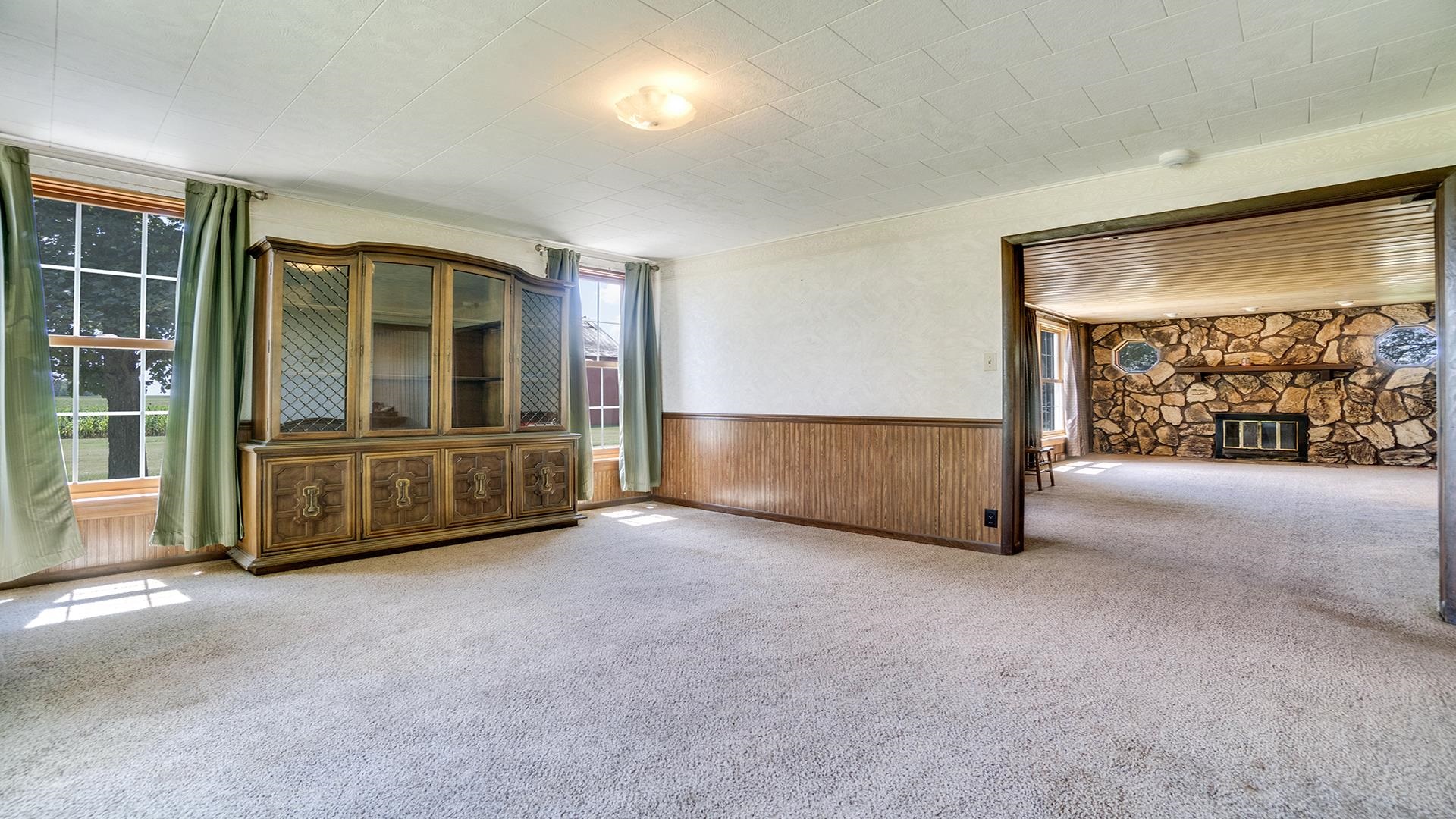 1813 Brooklyn Road Ashton, IL 61006 - Photo 8 of 43 a view of an empty room with a fireplace and window