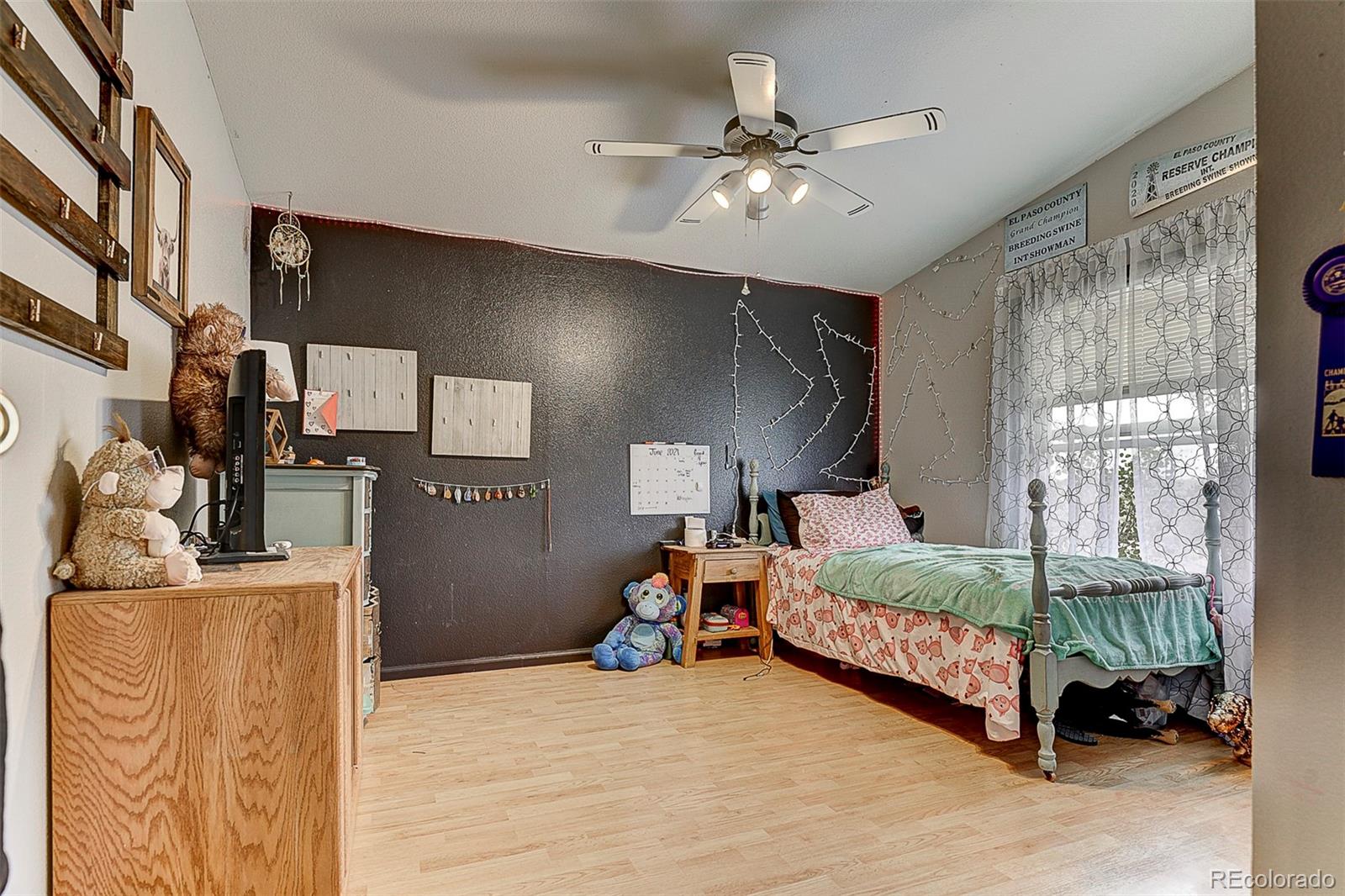 5255 North Yoder Road Yoder, CO 80864 - Photo 13 of 38 a bedroom with bed and window