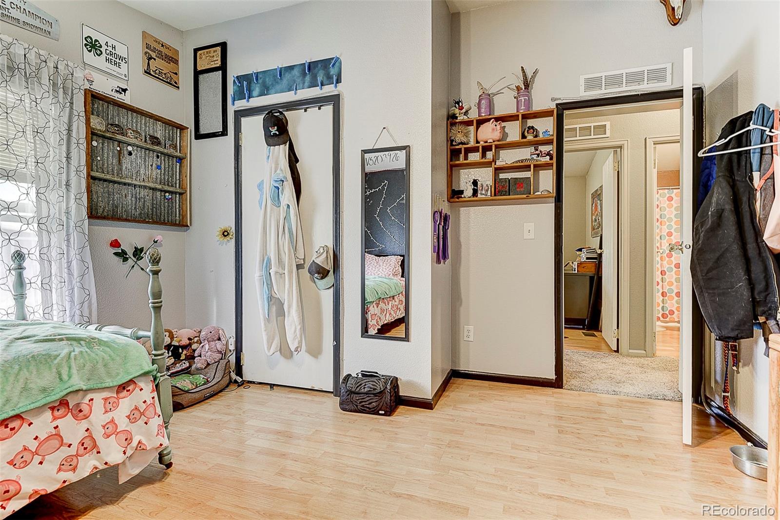5255 North Yoder Road Yoder, CO 80864 - Photo 14 of 38 a view of walk in closet with clothes and shoes