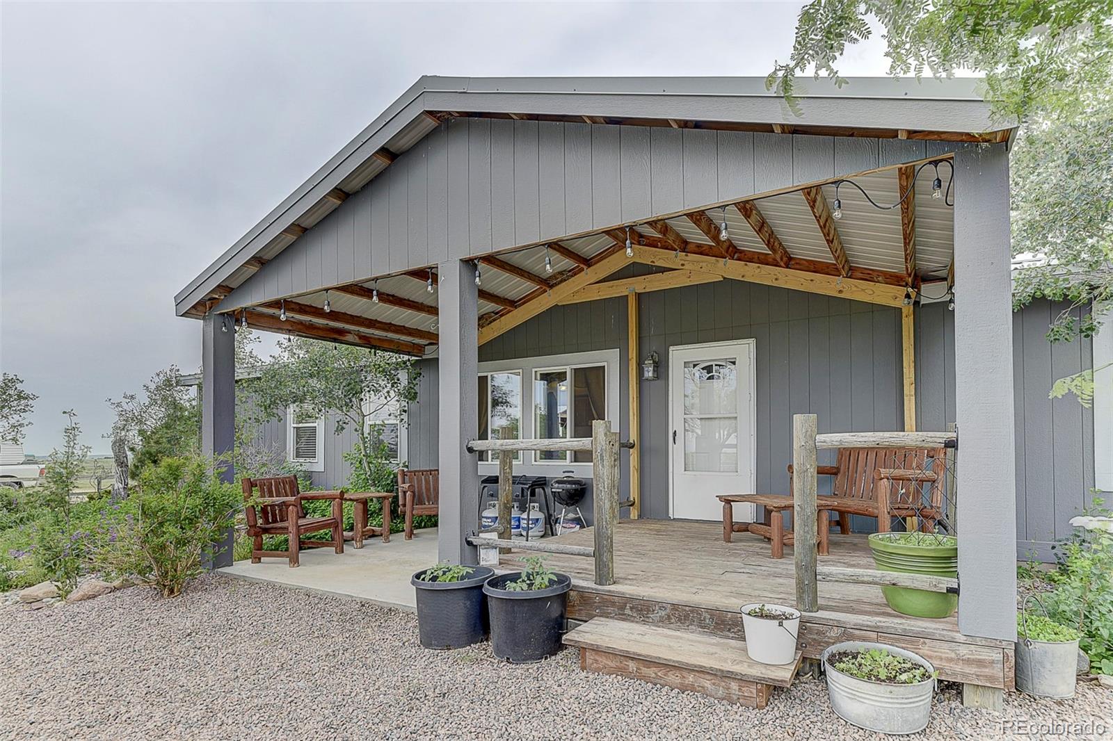 5255 North Yoder Road Yoder, CO 80864 - Photo 2 of 38 a front view of a house with seating space