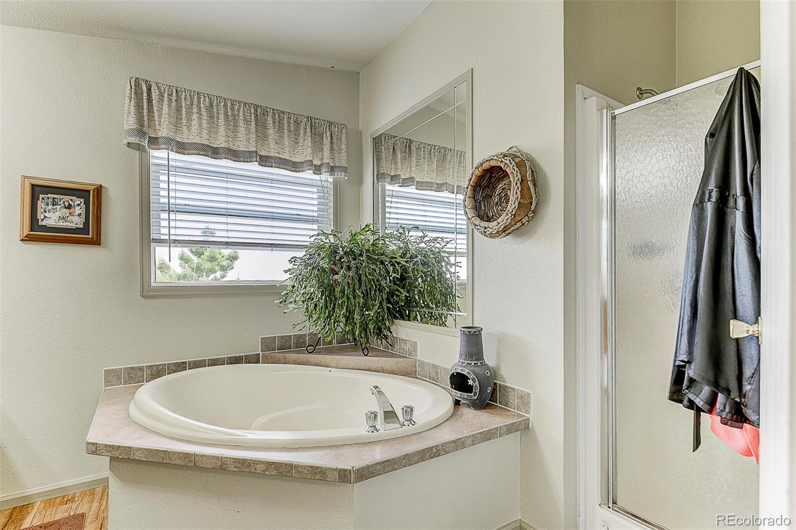 5255 North Yoder Road Yoder, CO 80864 - Photo 21 of 38 a bathroom with a tub and shower