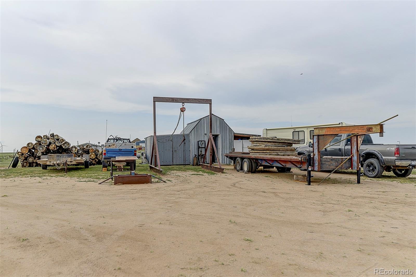 5255 North Yoder Road Yoder, CO 80864 - Photo 24 of 38 a view of a garage with parked cars