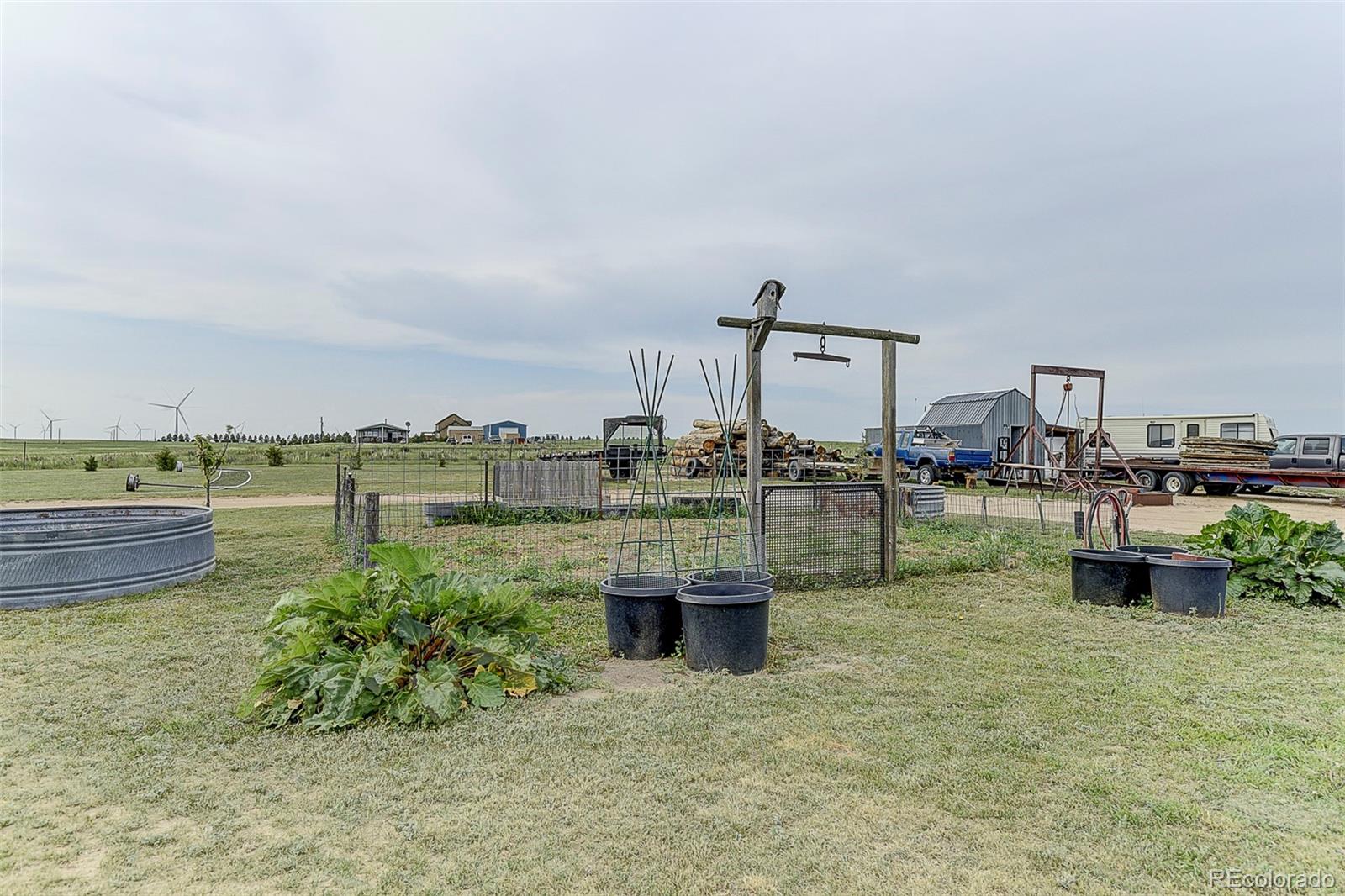 5255 North Yoder Road Yoder, CO 80864 - Photo 26 of 38 a view of a lake with a house