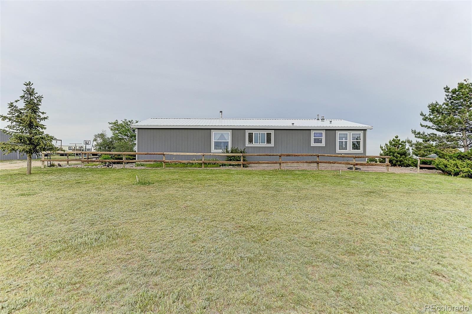 5255 North Yoder Road Yoder, CO 80864 - Photo 29 of 38 a view of pool with outdoor space and seating area