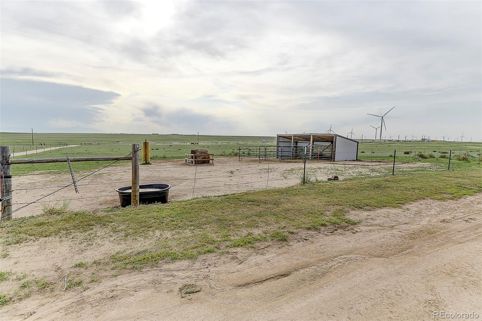 5255 North Yoder Road Yoder, CO 80864 - Photo 31 of 38 a view of a lake with a big yard