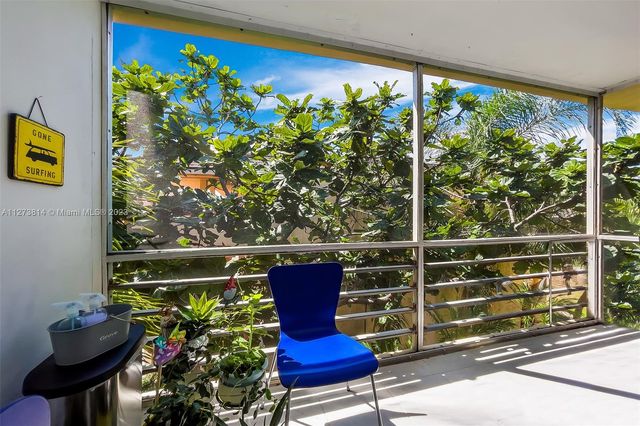 a view of a chairs and table in a outdoor room