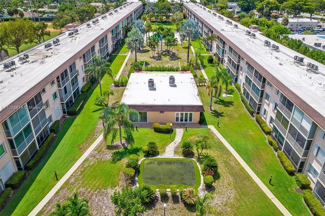 a view of an swimming pool with a garden