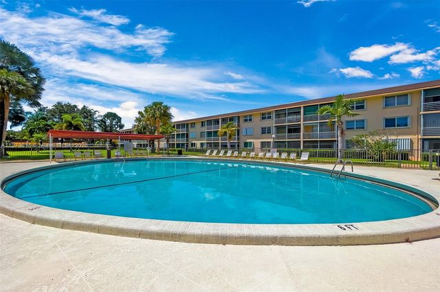 a view of swimming pool with a seating space