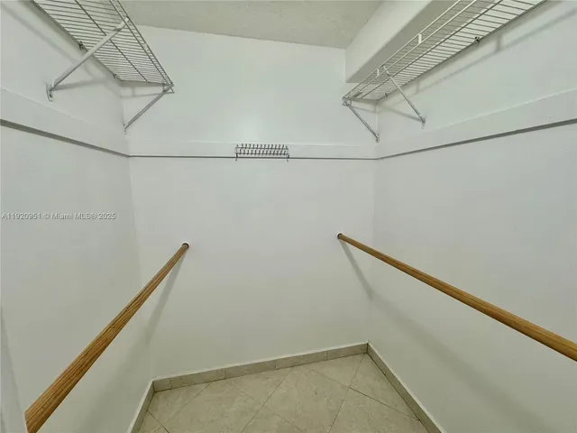 a view of a room with racks on the wall