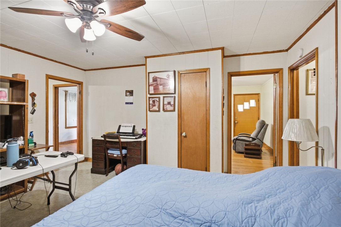 282 West Bennett Road Westminster, SC 29693 - Photo 20 of 42 This cozy bedroom offers a tranquil retreat with wood trim and a ceiling fan for comfort.