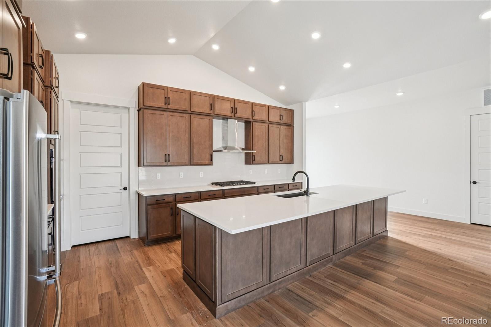 1738 Morningstar Way Fort Collins, CO 80524 - Photo 15 of 47 a kitchen with a sink stove and cabinets