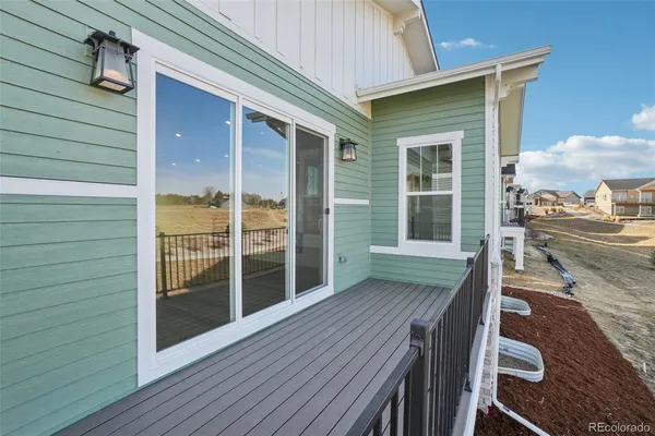 a view of a deck with wooden floor and seating space