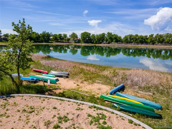a view of a lake with houses in the back