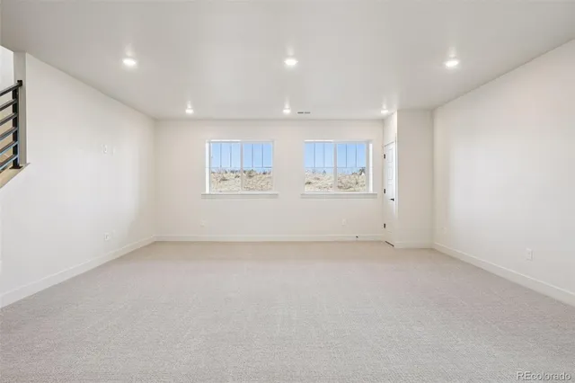 a view of a kitchen with a sink and a refrigerator