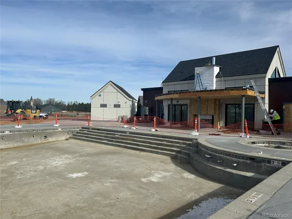 a view of swimming pool with outdoor seating