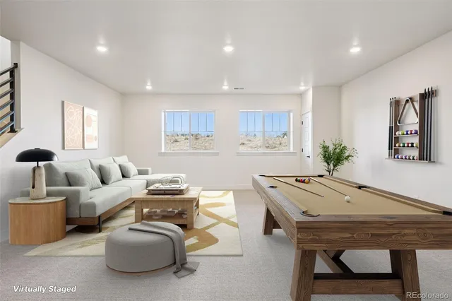 a living room with furniture and a table