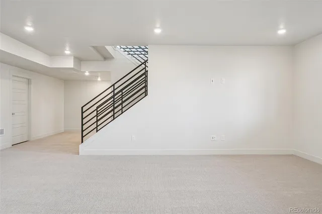 an empty room with wooden floor