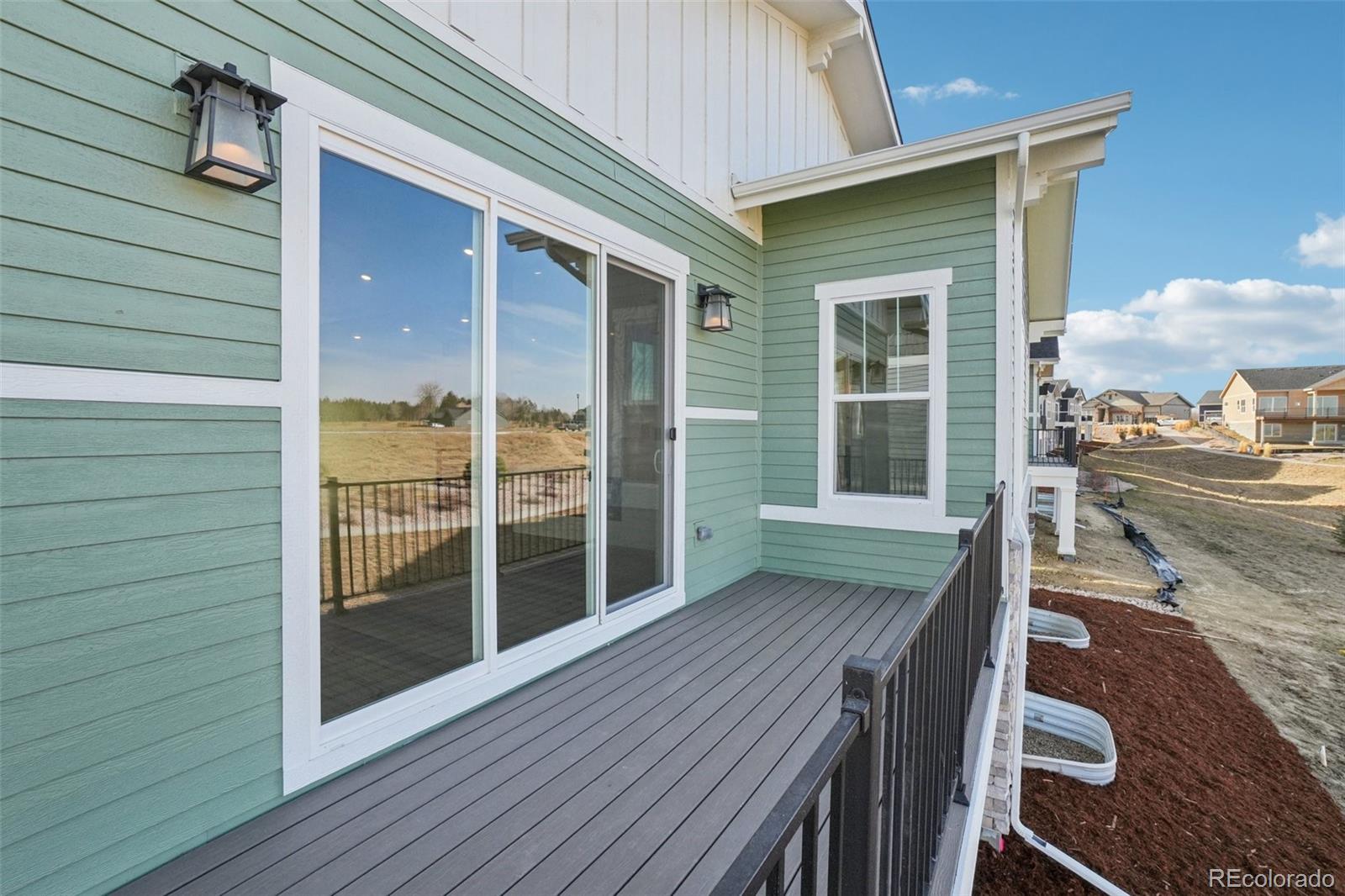 1738 Morningstar Way Fort Collins, CO 80524 - Photo 45 of 47 a view of a deck with wooden floor and seating space