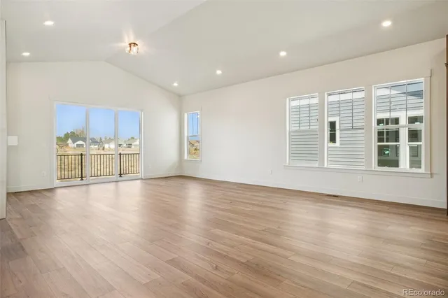 a view of a kitchen with a sink and a large window