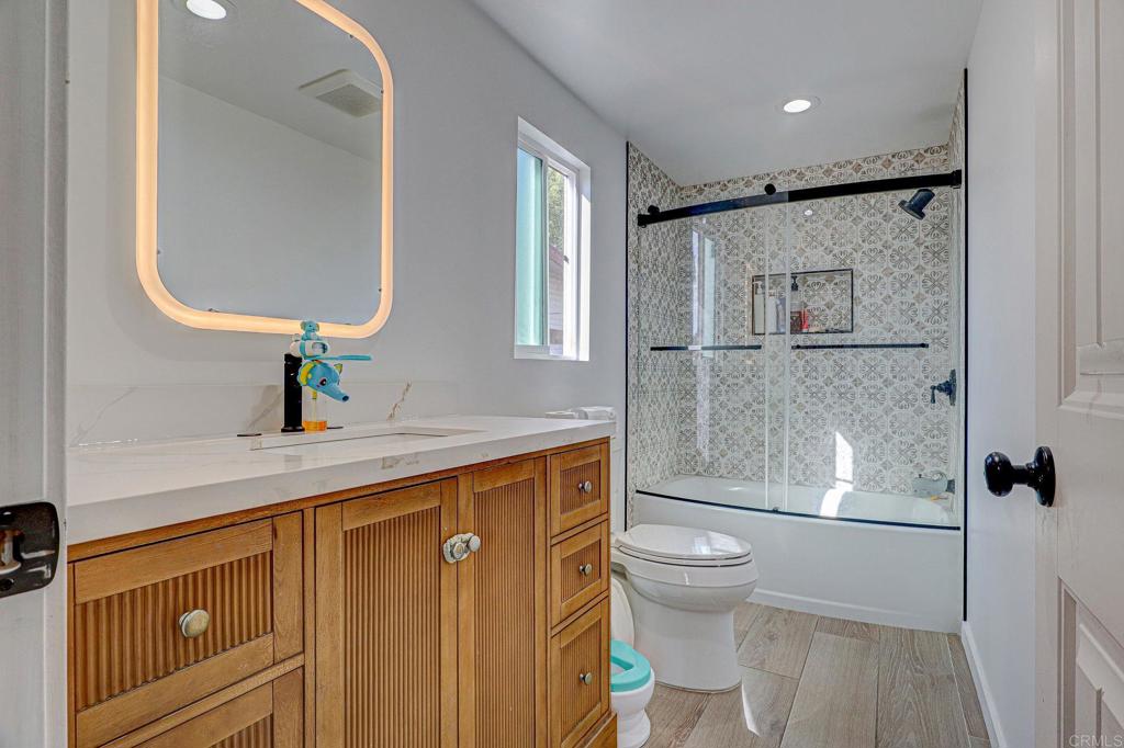 2515 Sweetwater Road, Unit SPC #23 Spring Valley, CA 91977 - Photo 17 of 21 a bathroom with a granite countertop sink toilet and shower