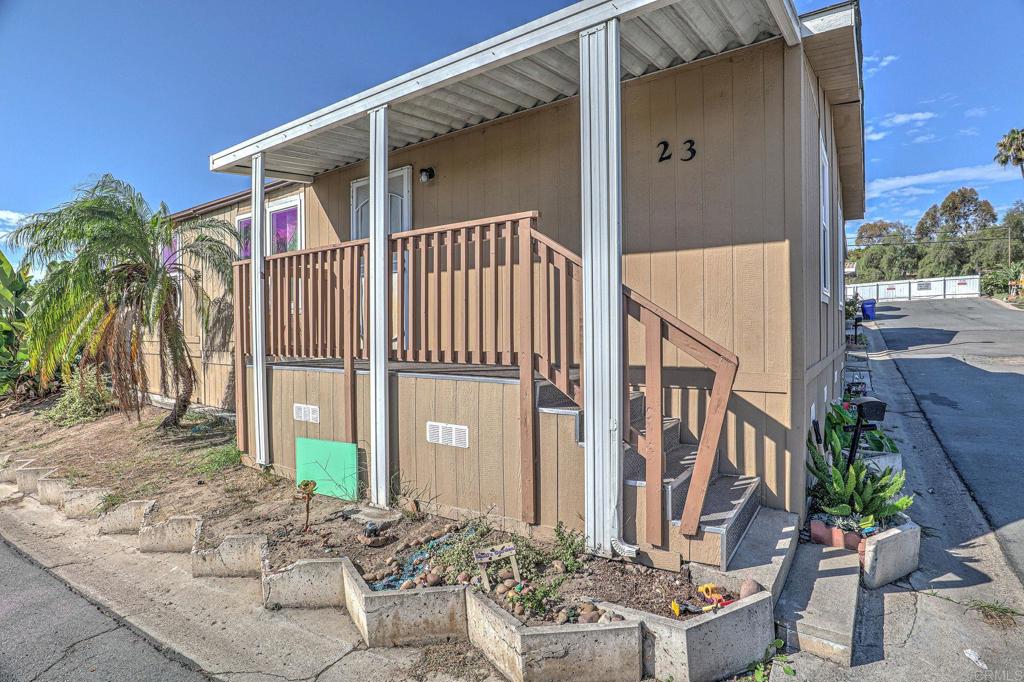 2515 Sweetwater Road, Unit SPC #23 Spring Valley, CA 91977 - Photo 2 of 21 a view of a house with backyard and sitting area