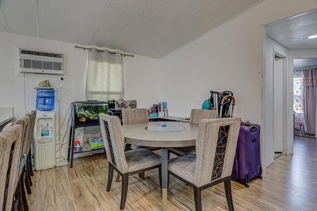 2515 Sweetwater Road, Unit SPC #23 Spring Valley, CA 91977 - Photo 7 of 21 a view of a dining room with furniture and wooden floor