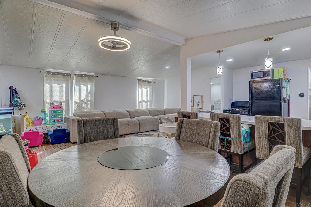2515 Sweetwater Road, Unit SPC #23 Spring Valley, CA 91977 - Photo 9 of 21 a living room with furniture and a flat screen tv