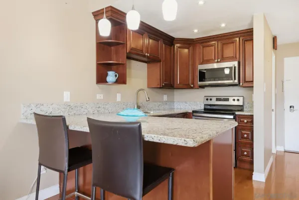 a kitchen with a sink cabinets and microwave