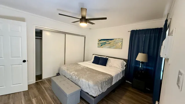 a bedroom with a bed and a closet