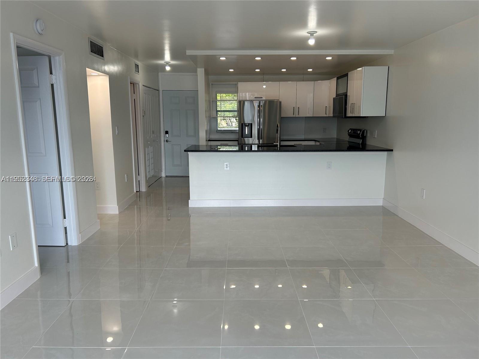 3550 Northeast 169th Street, Unit 304 North Miami Beach, FL 33160 - Photo 19 of 25 a view of a kitchen with a sink