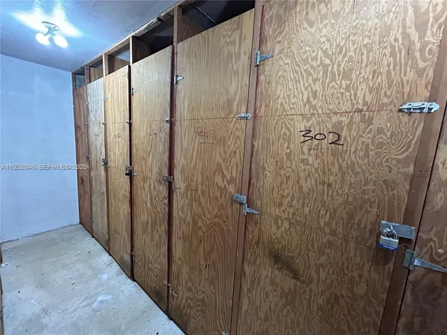 a bathroom with a glass door and shower