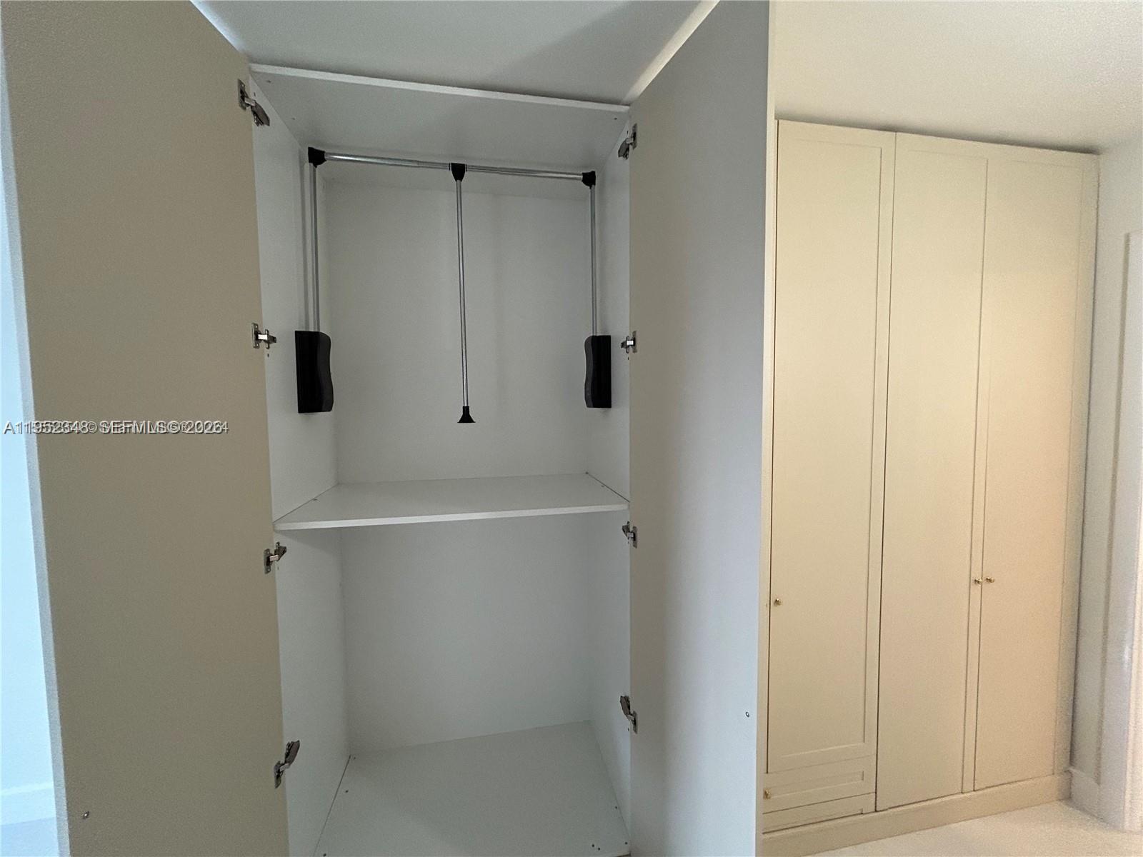 3550 Northeast 169th Street, Unit 304 North Miami Beach, FL 33160 - Photo 9 of 25 a bathroom with a shower