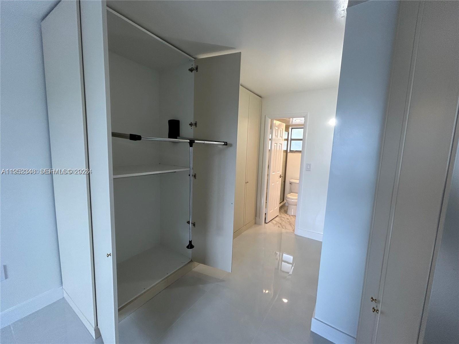 3550 Northeast 169th Street, Unit 304 North Miami Beach, FL 33160 - Photo 10 of 25 a view of a hallway