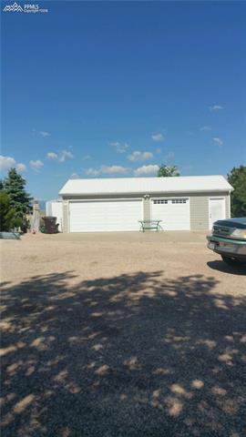 3380 Corral Ranch Road Peyton, CO 80831 - Photo 2 of 25 20 x 35 garage with the 3rd door a pull through
