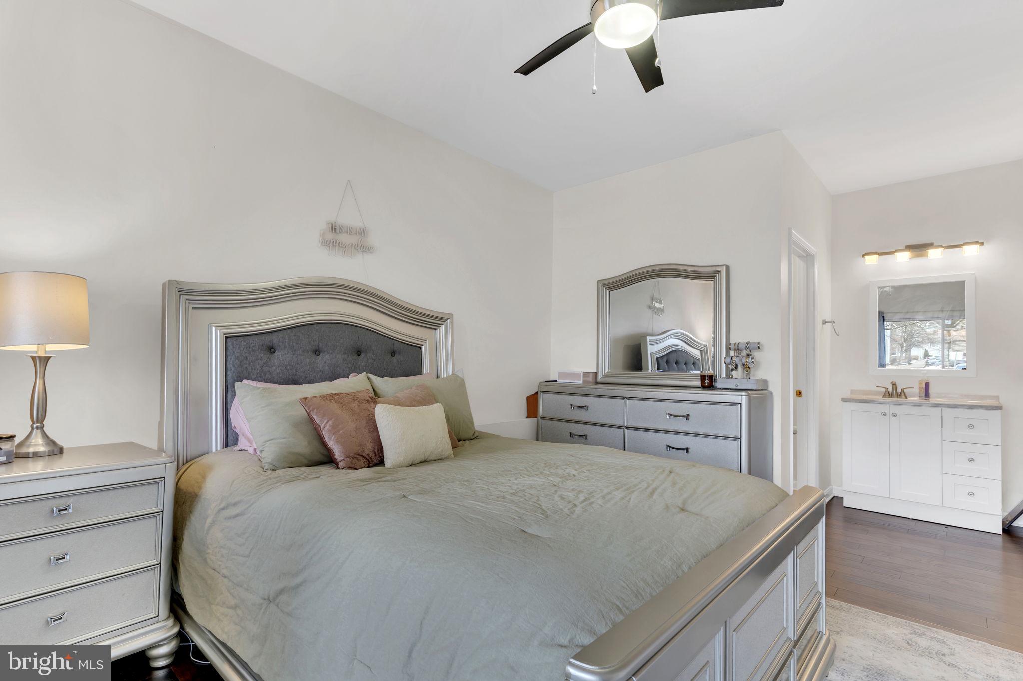 604 Moonglow Road, Unit 104 Odenton, MD 21113 - Photo 12 of 19 a bedroom with a bed and a dresser