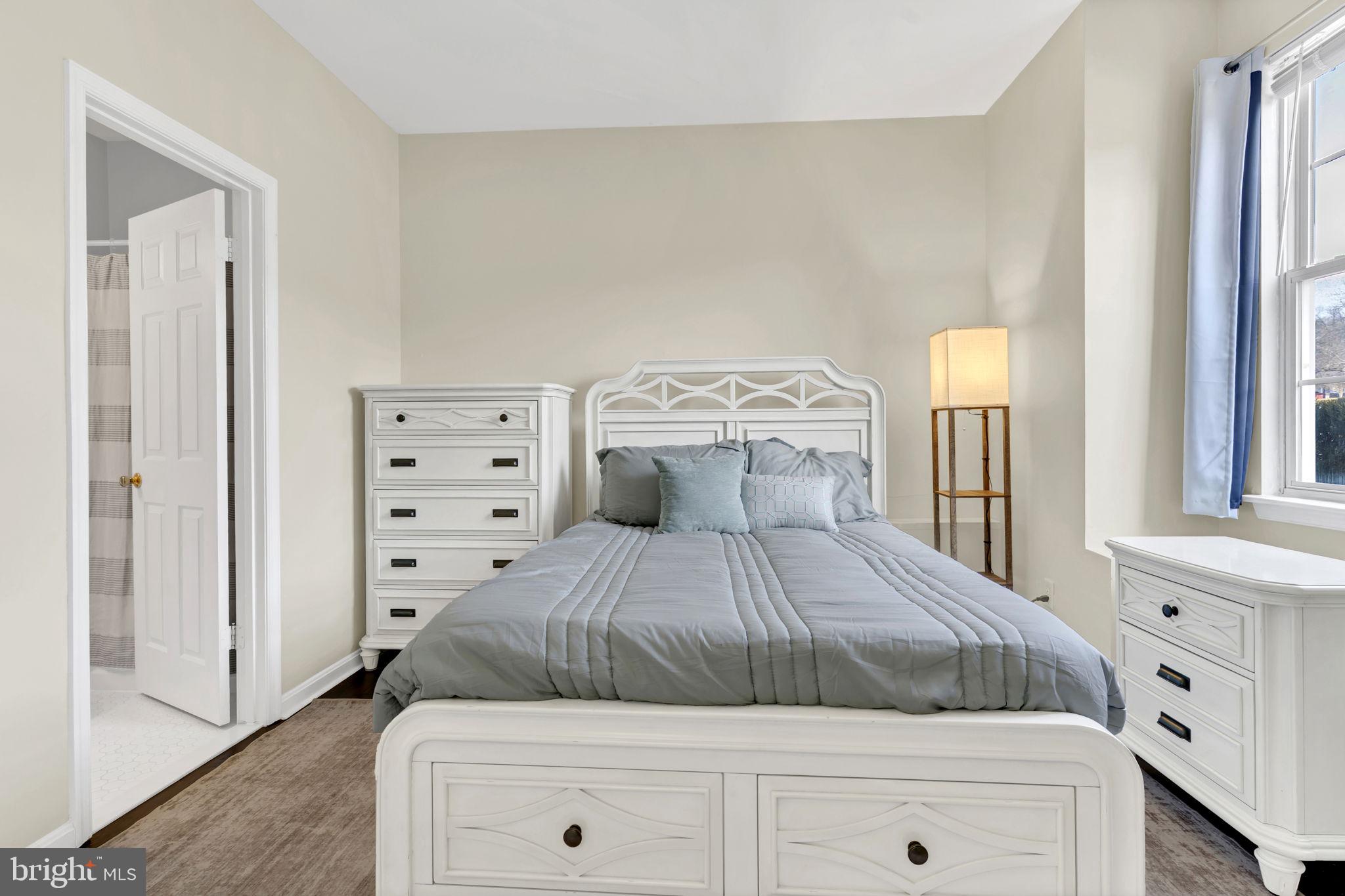 604 Moonglow Road, Unit 104 Odenton, MD 21113 - Photo 14 of 19 a bedroom with a bed and a window