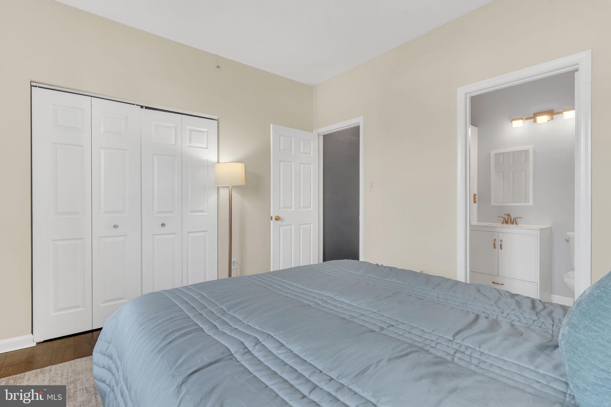 604 Moonglow Road, Unit 104 Odenton, MD 21113 - Photo 15 of 19 a bedroom with a bed and a shower