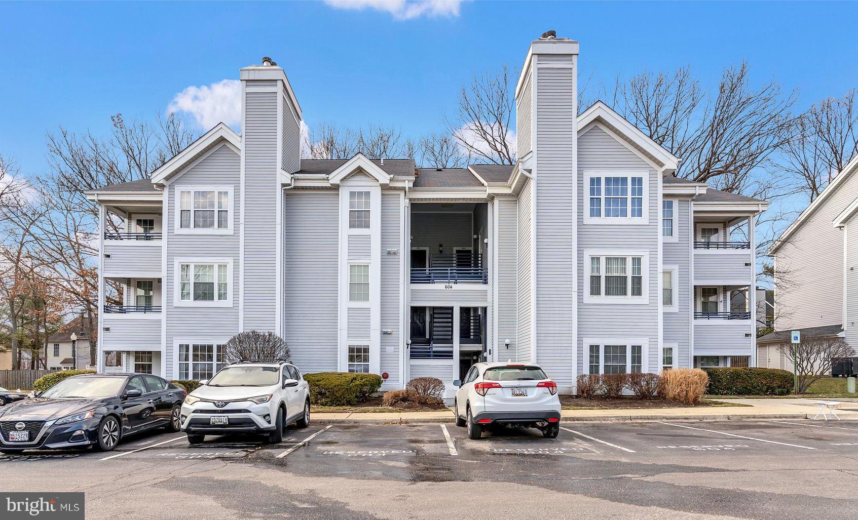 604 Moonglow Road, Unit 104 Odenton, MD 21113 - Photo 2 of 19 a car parked in front of a brick building