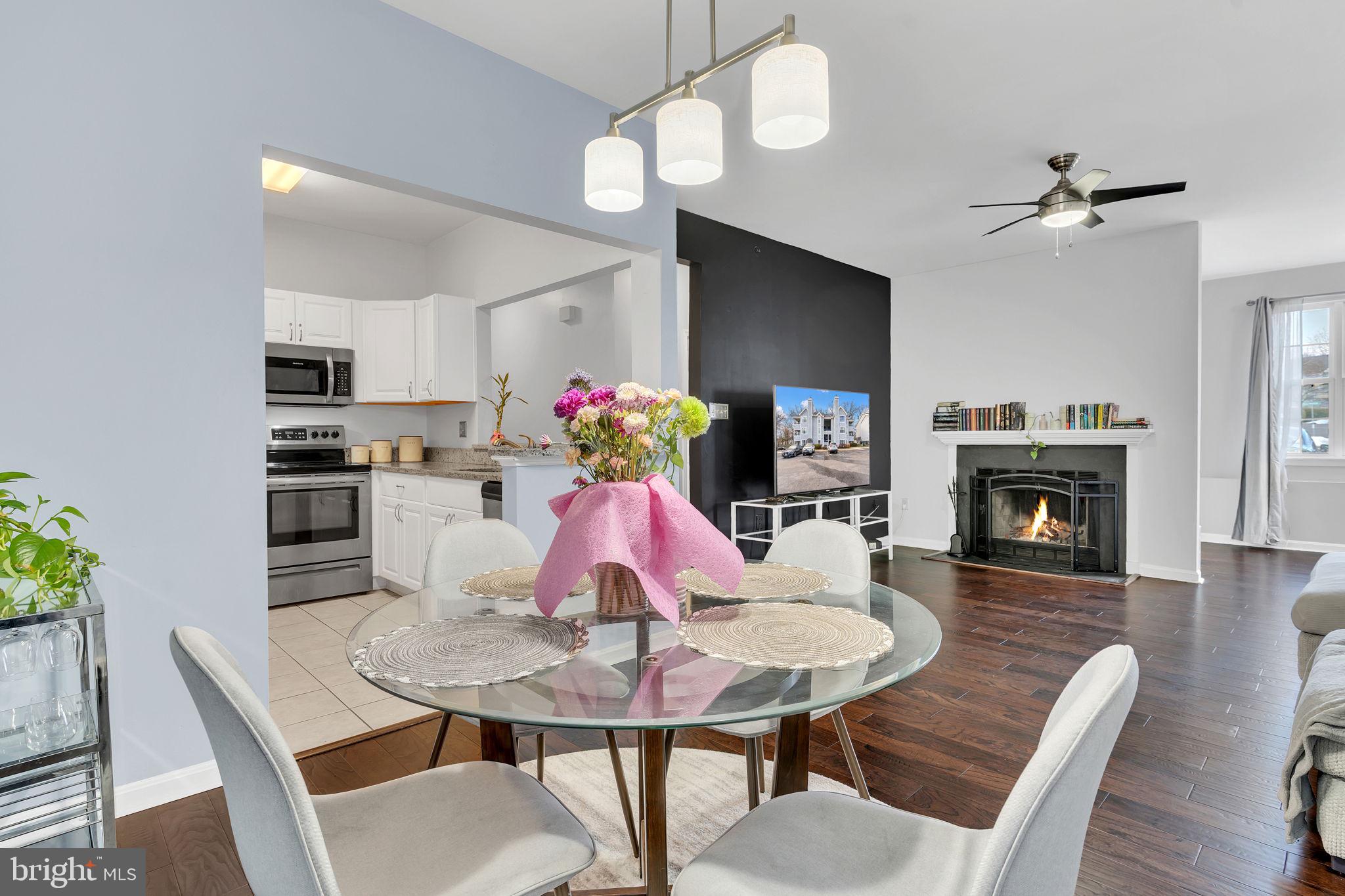 604 Moonglow Road, Unit 104 Odenton, MD 21113 - Photo 7 of 19 a view of a dining room with furniture and wooden floor