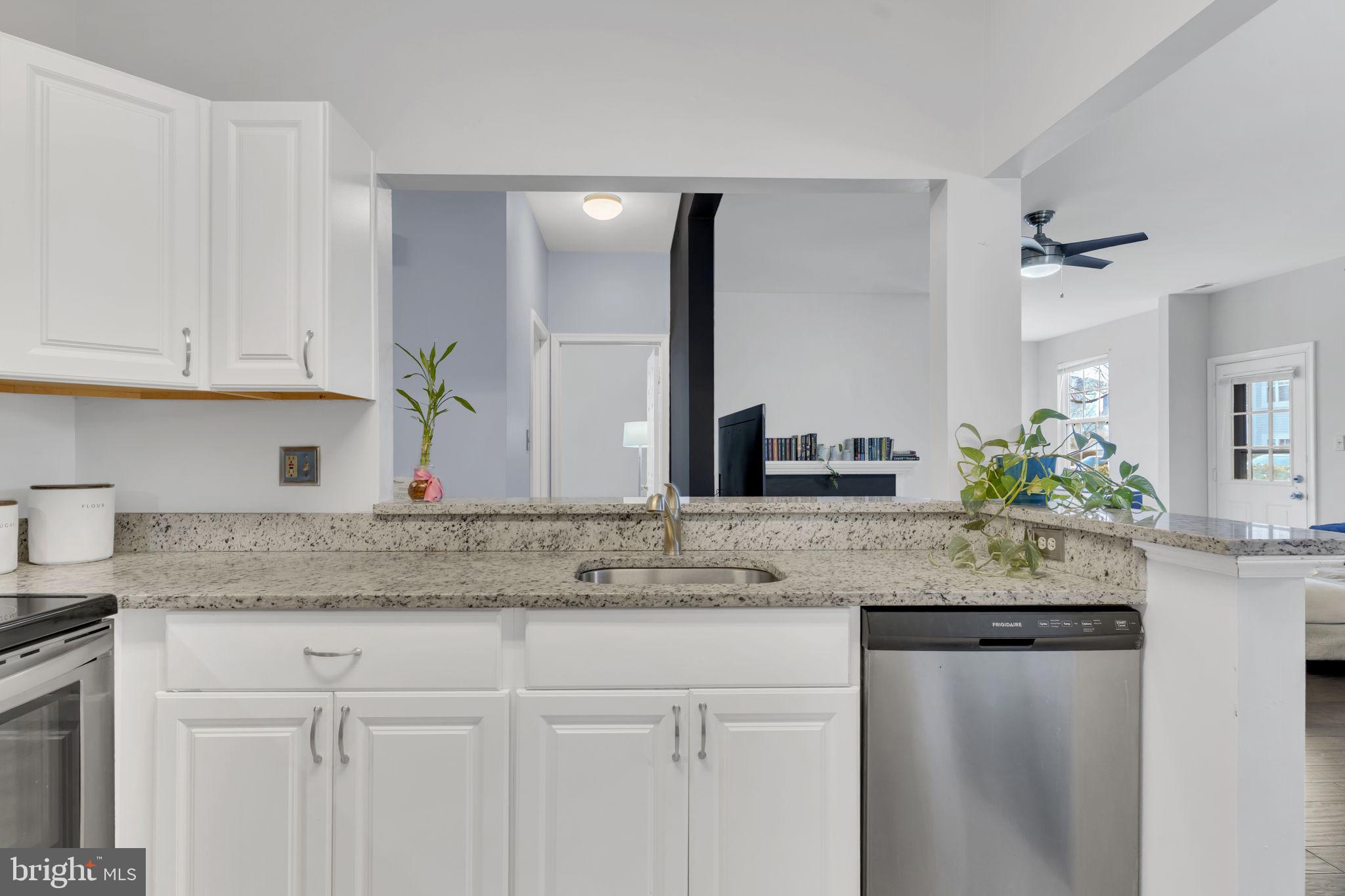 604 Moonglow Road, Unit 104 Odenton, MD 21113 - Photo 9 of 19 a view white kitchen with granite countertop a sink