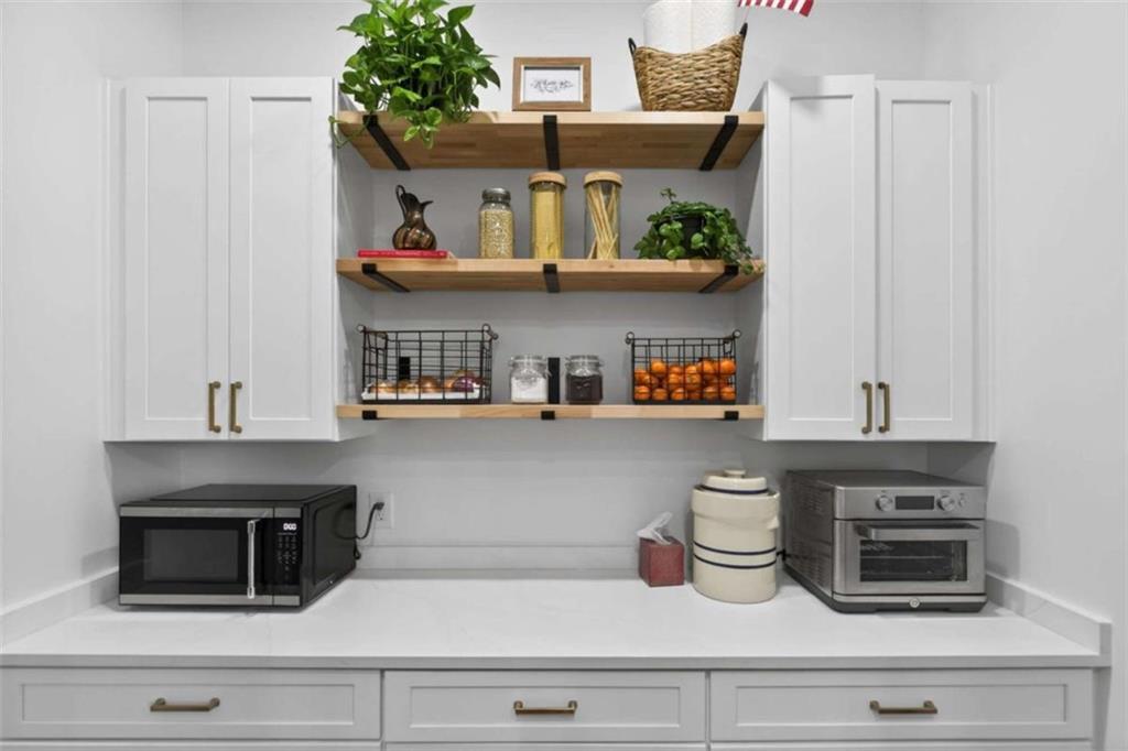433 Old Roanoke Road Bowdon, GA 30108 - Photo 17 of 52 a kitchen with a refrigerator and cabinets