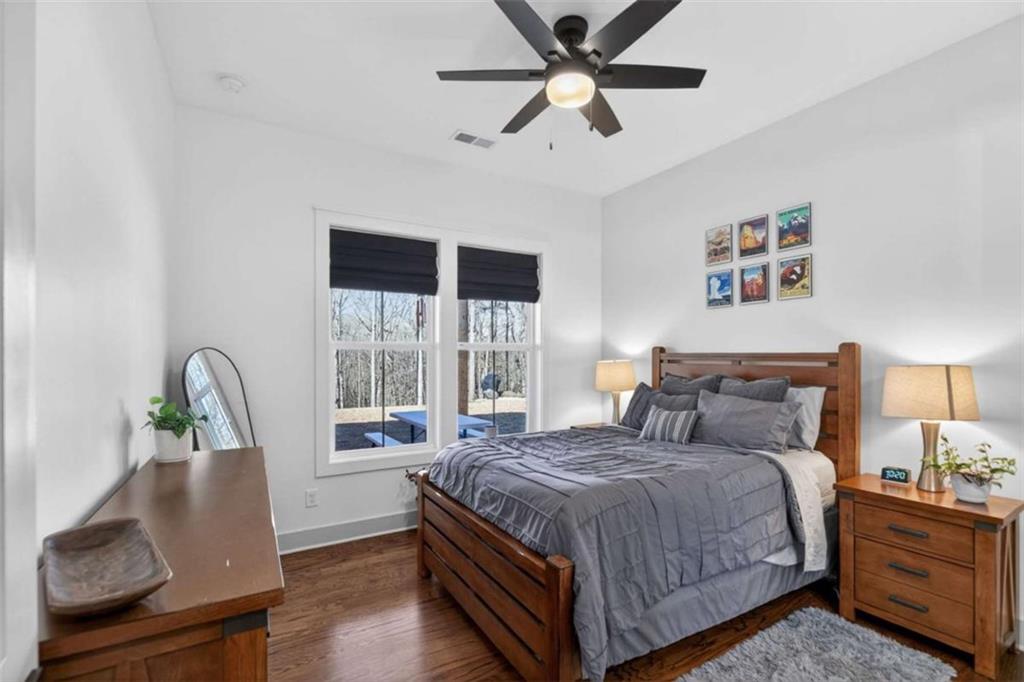433 Old Roanoke Road Bowdon, GA 30108 - Photo 19 of 52 a bedroom with a large bed and a window