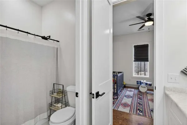 a bedroom with furniture and a window